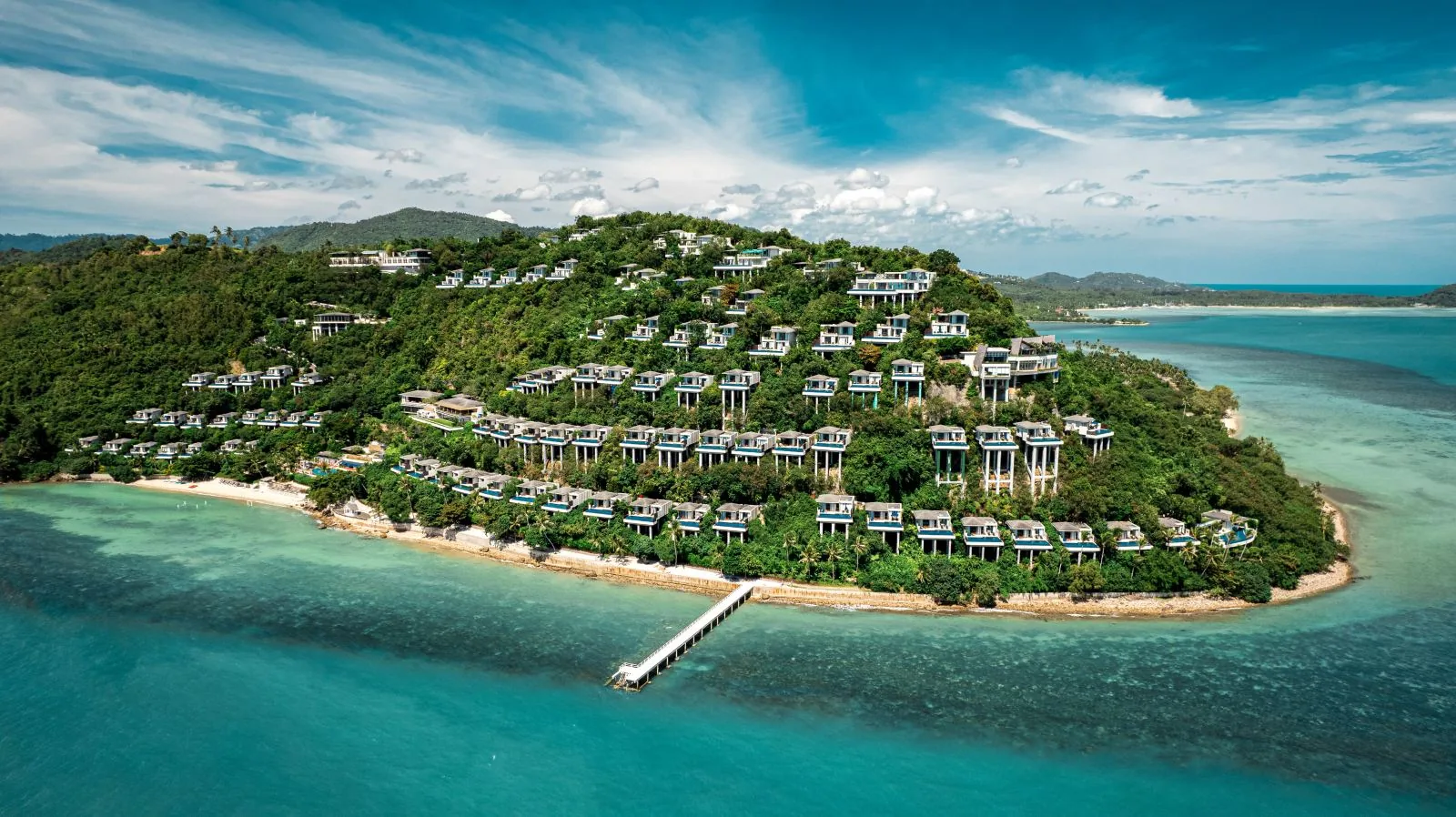 Conrad Koh Samui — aerial of the hillside villas above the sea